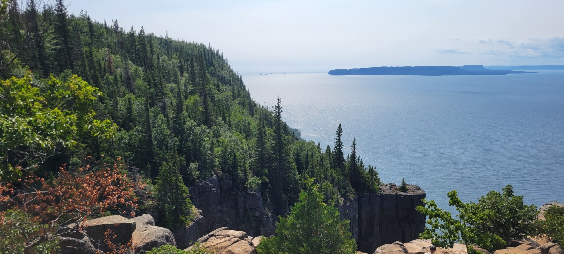 The cliffs over Lake Superior, with green trees and steep dropoffs.