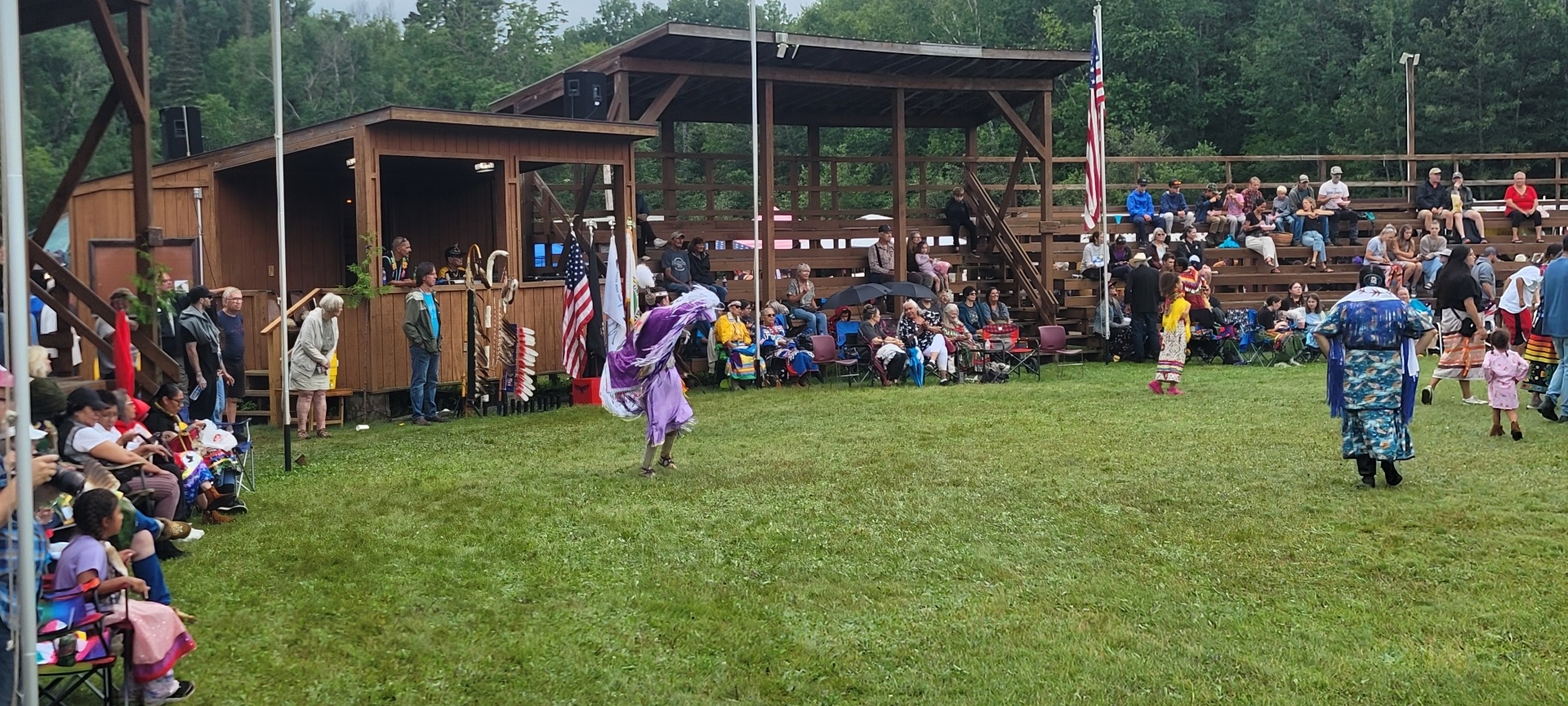 PowWow with a woman in purple dancing.