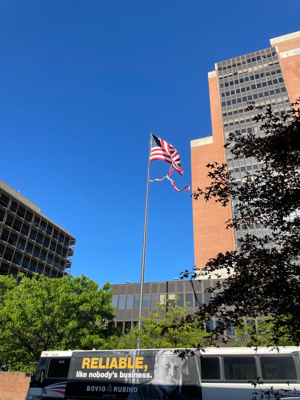 Badly tattered american flag flapping in the wind in philadelphia