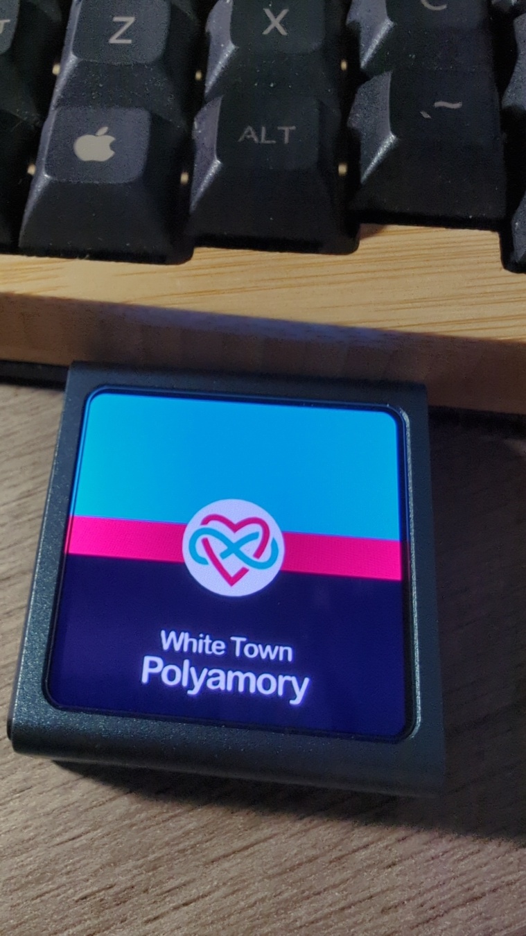 A tiny, square, grey metal, mp3 player. It's more screen than anything else. Currently the screen displays the album cover for 