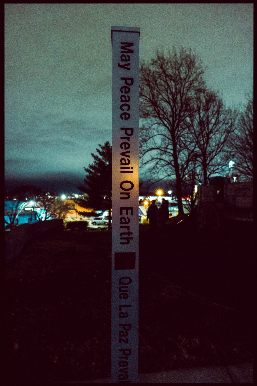An art installation that’s a pole stating “May peace prevail on earth “ in multiple languages